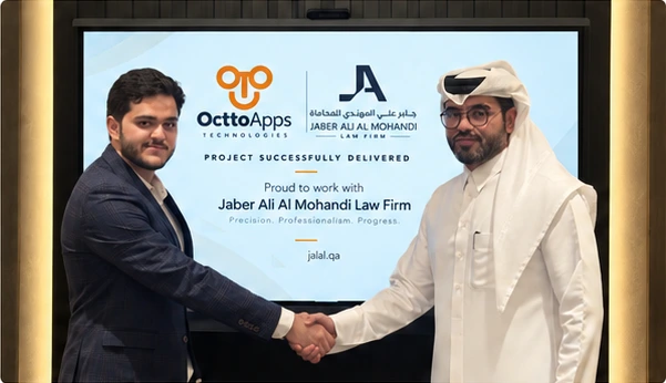 OcttoApps and Jaber Ali Almohandi Law Firm shaking hands in front of a screen marking the successful delivery of the project
